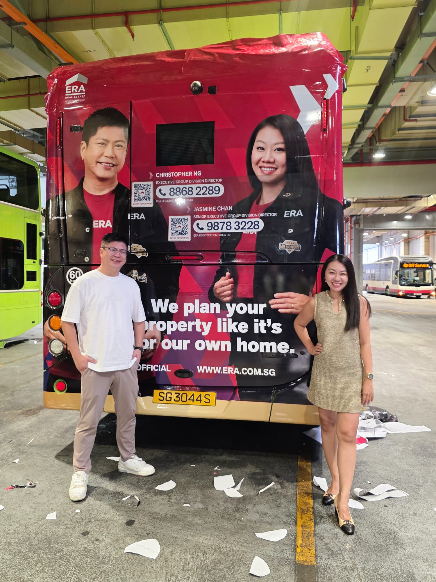 Close-up of the ERA bus rear wrap featuring Christopher Ng and Jasmine Chan with contact details